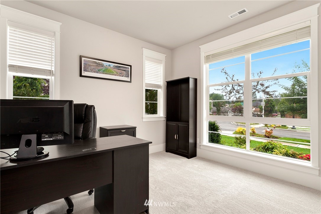 253 Field Place Southeast Renton, WA 98059 - Photo 5 of 40 a view of a workspace with furniture and a window