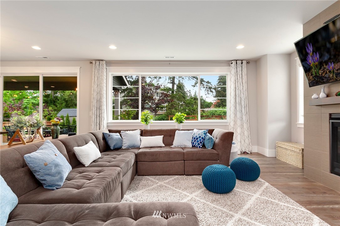 253 Field Place Southeast Renton, WA 98059 - Photo 10 of 40 a living room with furniture and a large window