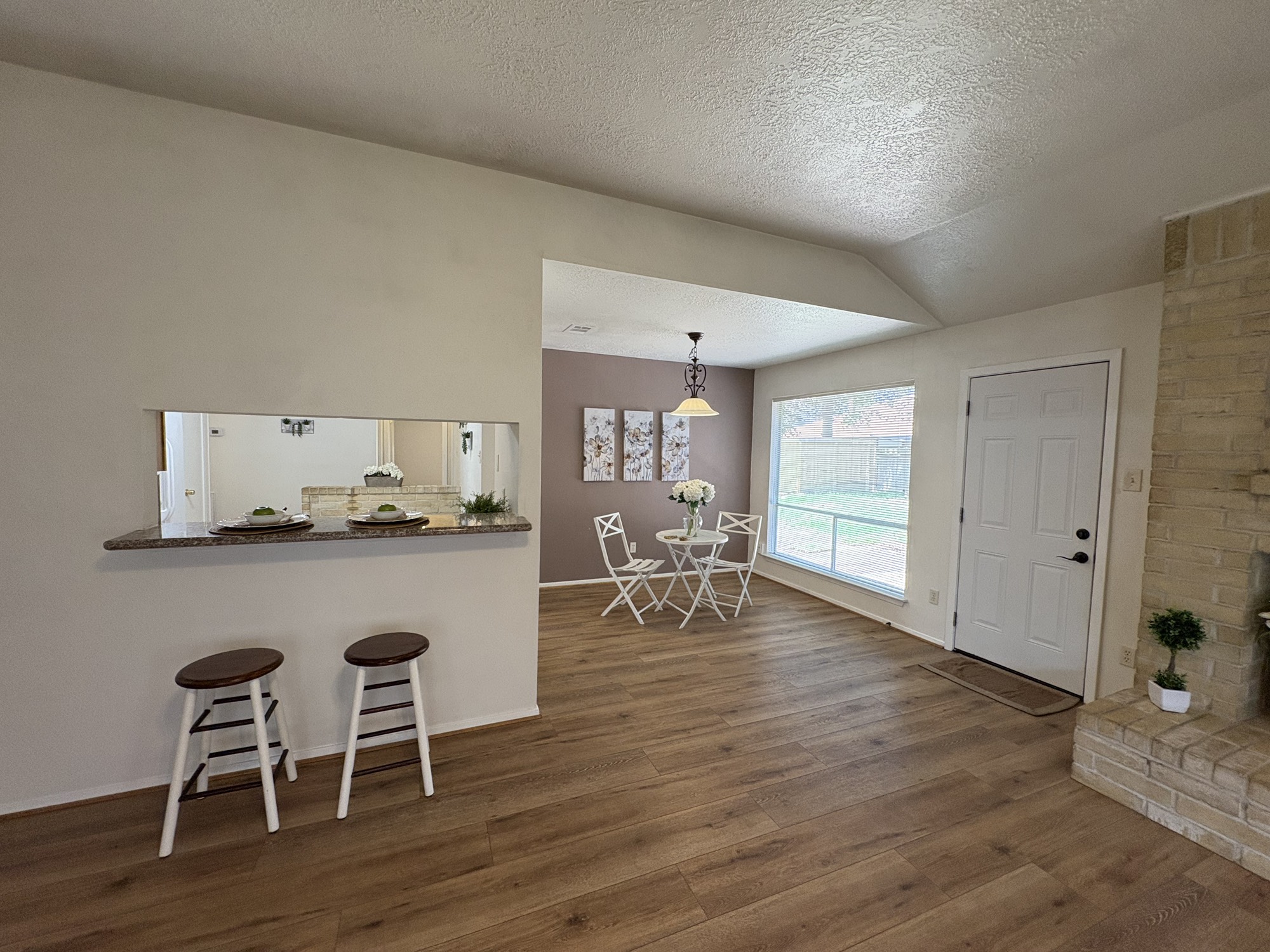 4834 Bridgemont Lane Spring, TX 77388 - Photo 4 of 23 Breakfast Bar and Breakfast Area Open to Living Area w/Views of Back Patio