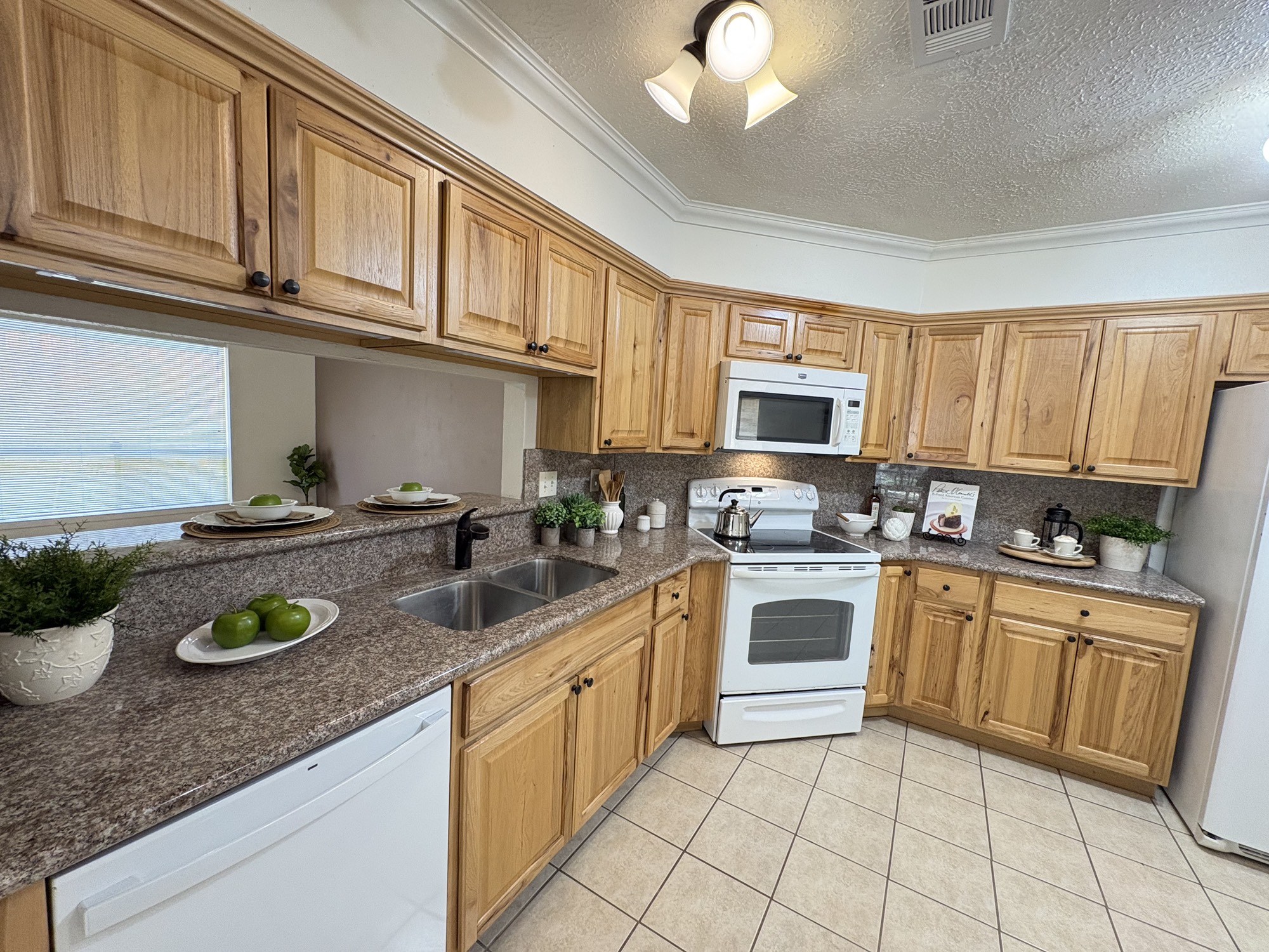 4834 Bridgemont Lane Spring, TX 77388 - Photo 6 of 23 Spacious Granite Kitchen with Plenty of Cabinets and Undermount Lighting at Bar Area