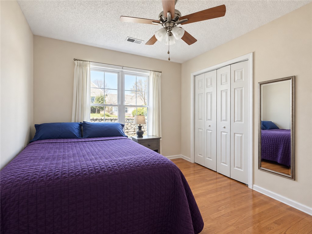 113 Grand Oak Circle Pendleton, SC 29670 - Photo 18 of 25 Rich wood floors and abundant natural light define this cozy secondary bedroom.