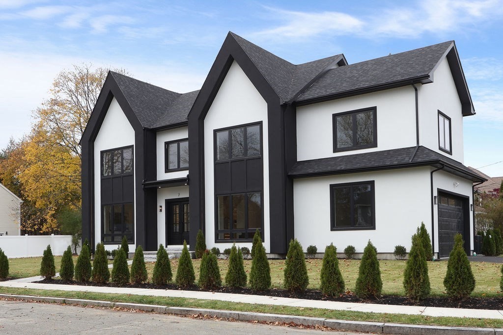 7 Hay Road Newton, MA 02459 - Photo 1 of 20 a view of a white house with large windows