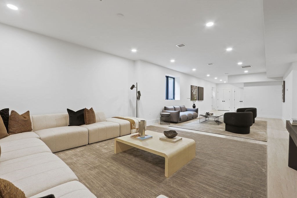 7 Hay Road Newton, MA 02459 - Photo 18 of 20 a living room with furniture a flat screen tv and a couch