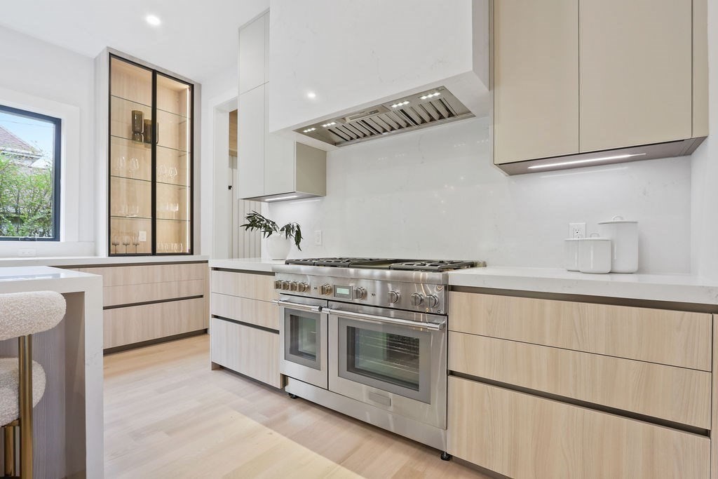 7 Hay Road Newton, MA 02459 - Photo 7 of 20 a kitchen with stainless steel appliances granite countertop a stove and a sink