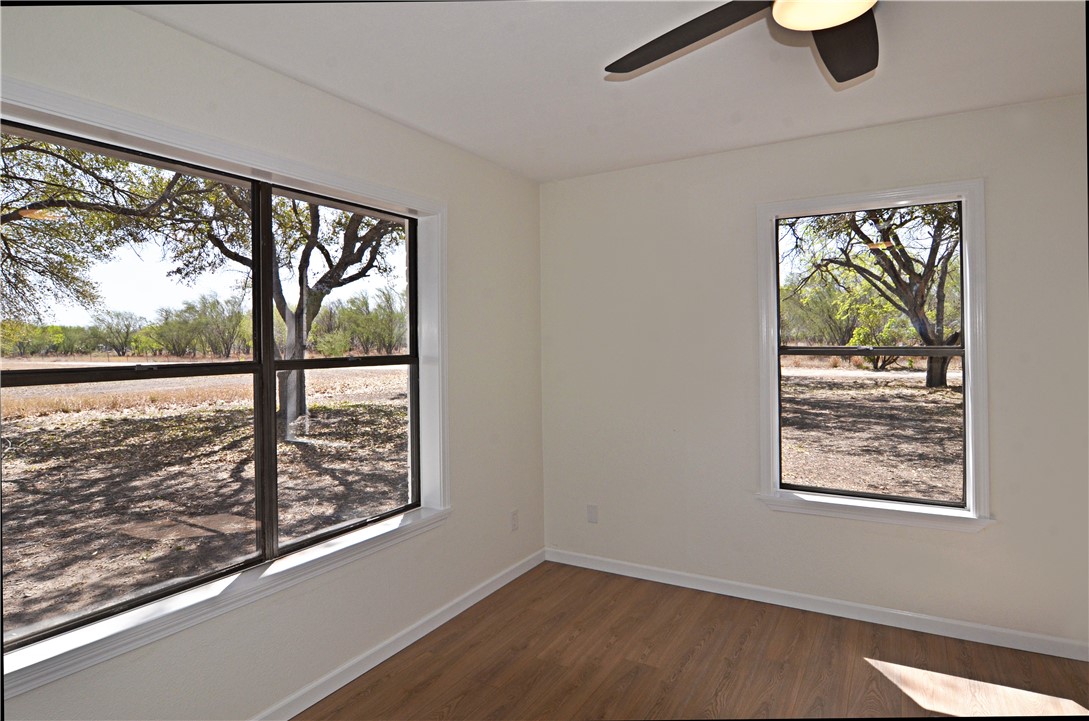 202 Ranch Road Mathis, TX 78368 - Photo 11 of 36 an empty room with windows
