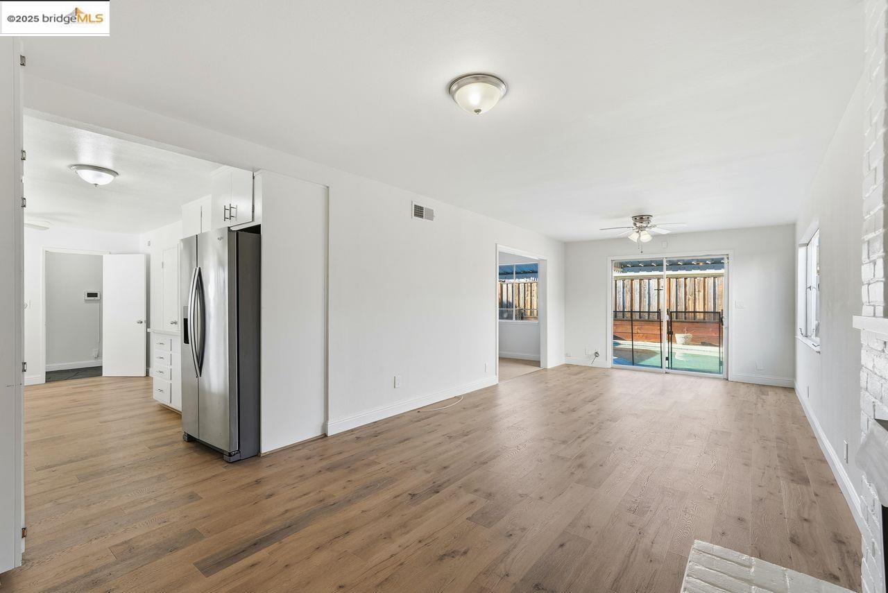 620 Chevy Chase Way Hayward, CA 94544 - Photo 13 of 38 a view of an empty room with wooden floor and a window