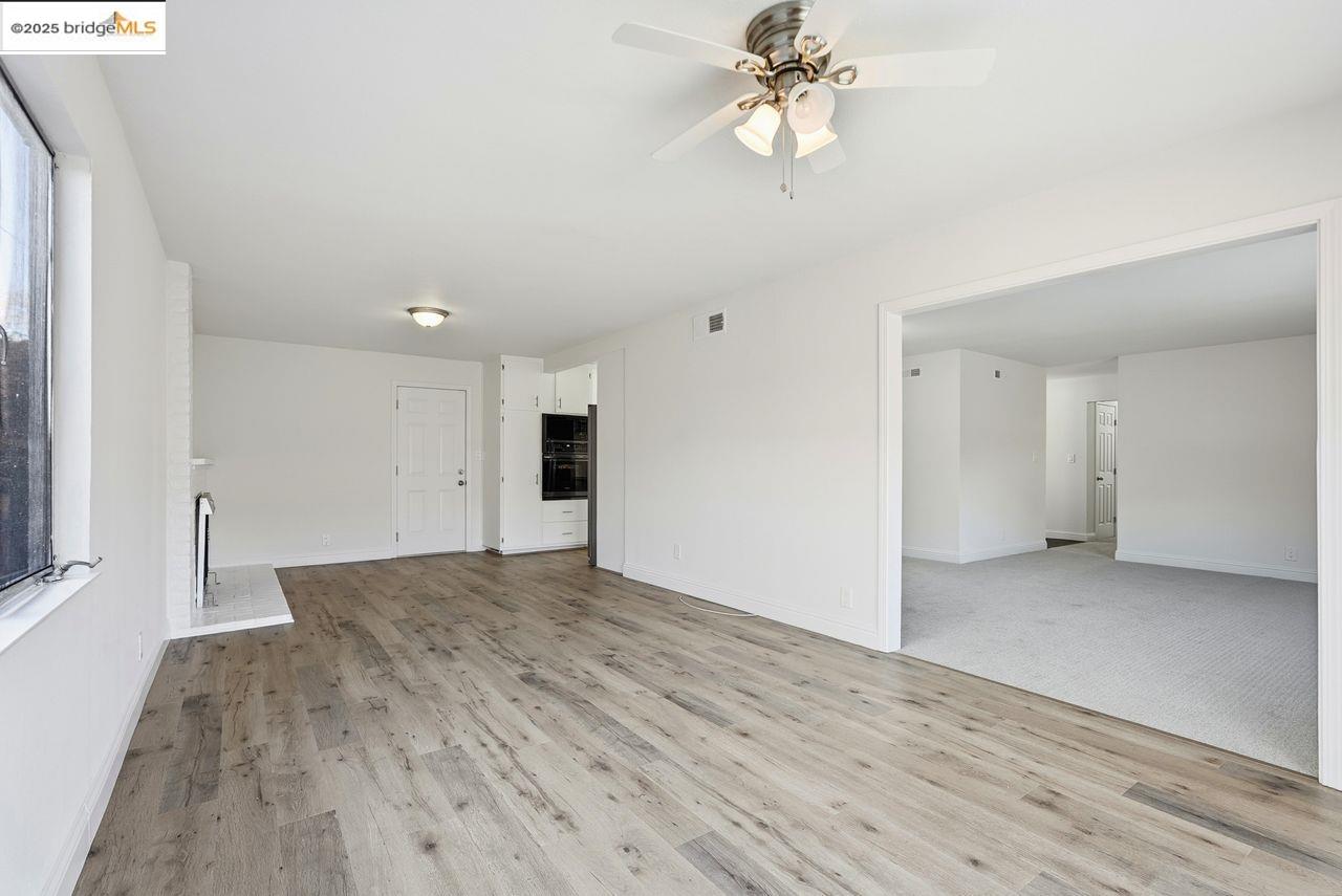 620 Chevy Chase Way Hayward, CA 94544 - Photo 16 of 38 wooden floor in an empty room with a window