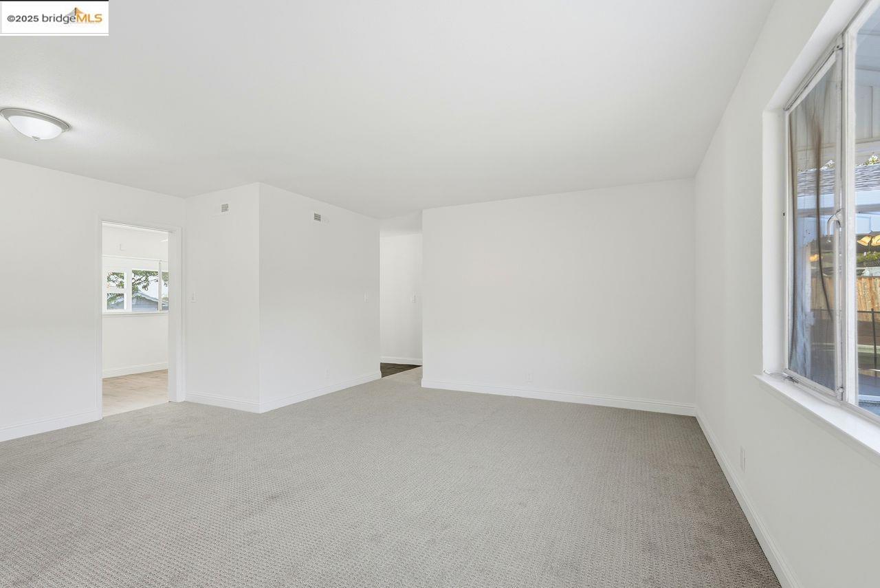 620 Chevy Chase Way Hayward, CA 94544 - Photo 18 of 38 an empty room with windows