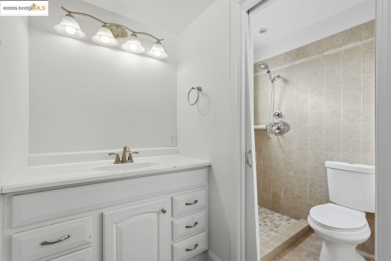 620 Chevy Chase Way Hayward, CA 94544 - Photo 32 of 38 a bathroom with a sink a toilet and shower