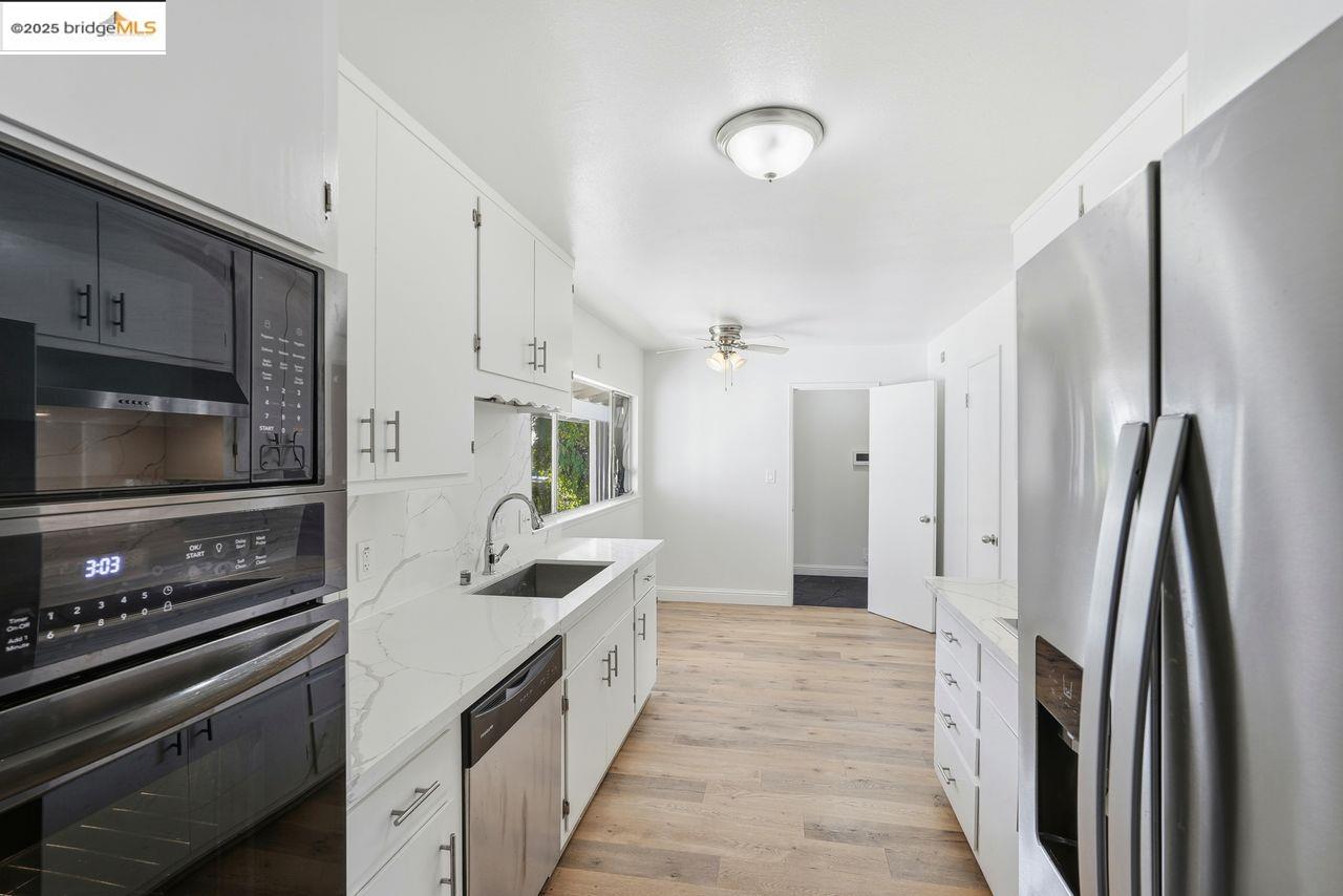 620 Chevy Chase Way Hayward, CA 94544 - Photo 9 of 38 a large kitchen with a stove and a refrigerator