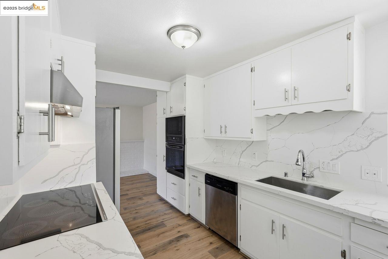 620 Chevy Chase Way Hayward, CA 94544 - Photo 10 of 38 a kitchen with granite countertop a sink stainless steel appliances and cabinets