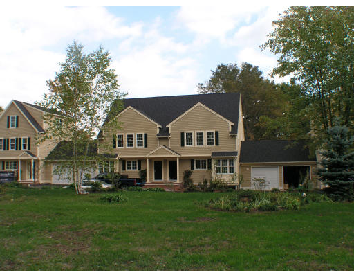 50 Pickering Street, Unit 3 Danvers, MA 01923 - Photo 1 of 1 a front view of a house with a yard