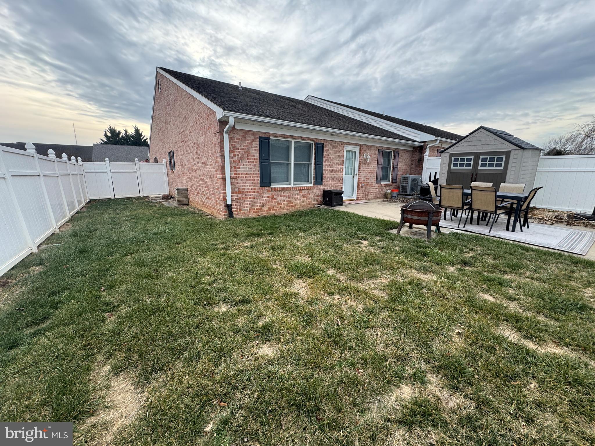 720 Naples Drive Hagerstown, MD 21740 - Photo 2 of 19 a backyard of a house with table and chairs