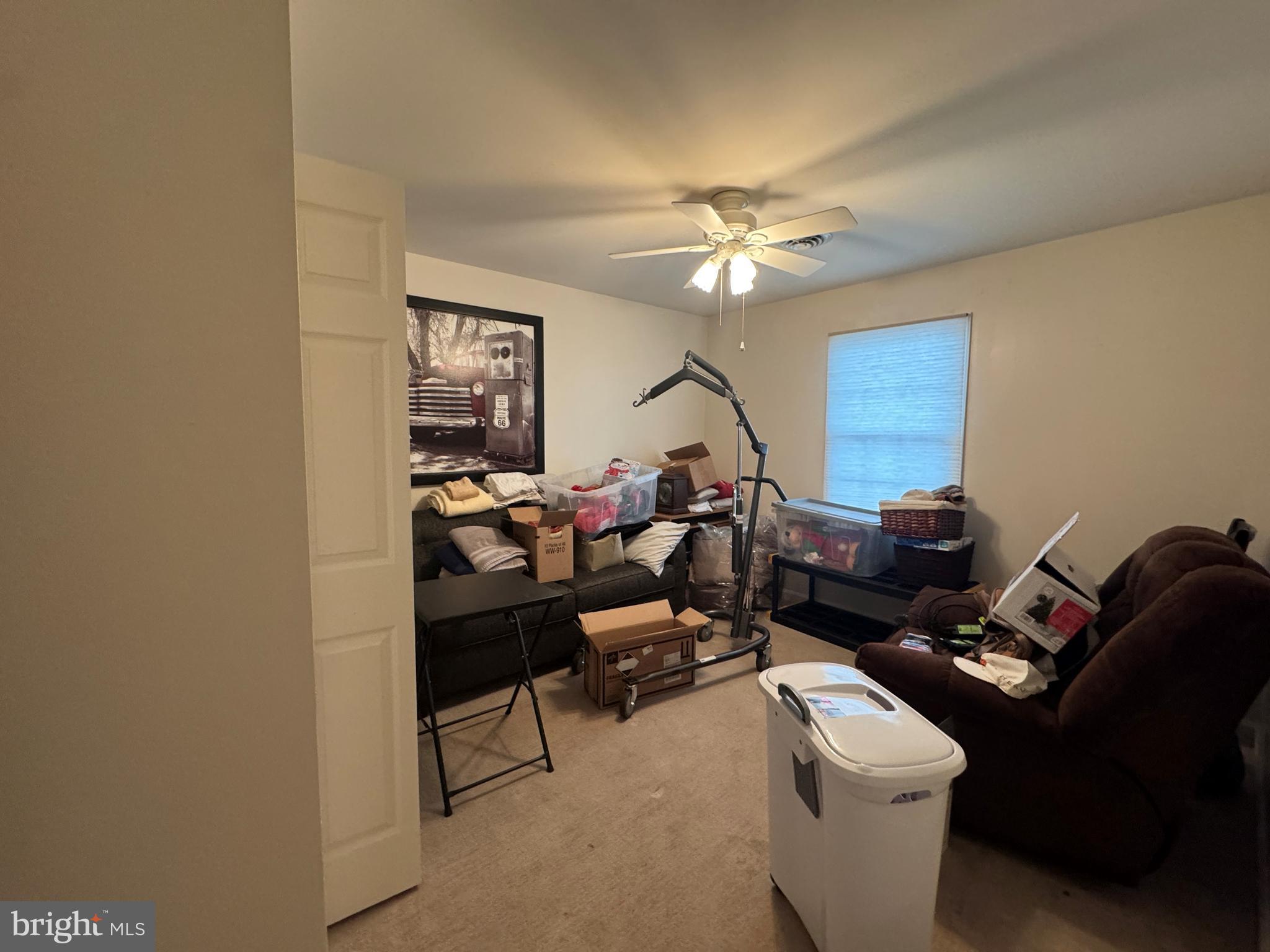720 Naples Drive Hagerstown, MD 21740 - Photo 9 of 19 a living room with furniture a chandelier and a window