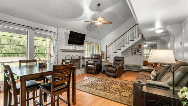 a living room with furniture or flat screen tv and a fireplace