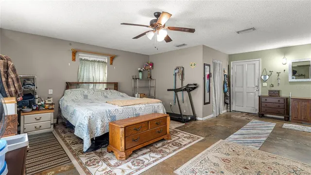 a view of hall way with furniture and closet