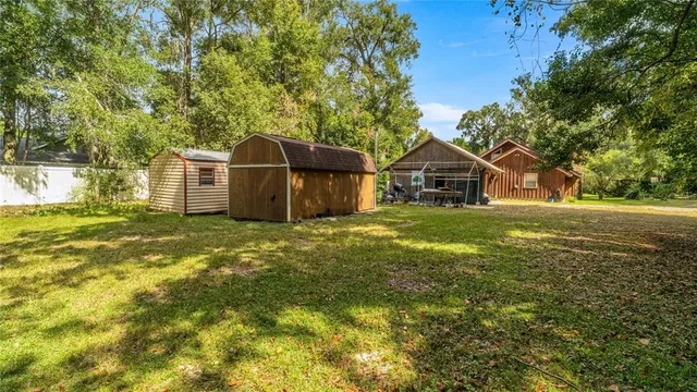 a kitchen with stainless steel appliances granite countertop a refrigerator stove and sink