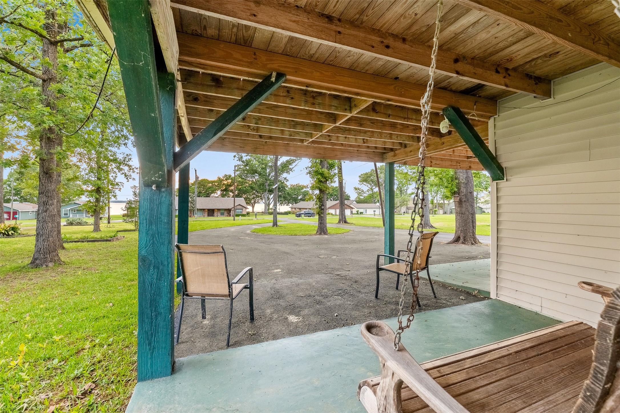 439 Lakeview Harbor Onalaska, TX 77360 - Photo 29 of 43 a view of porch with a table and chairs under an umbrella