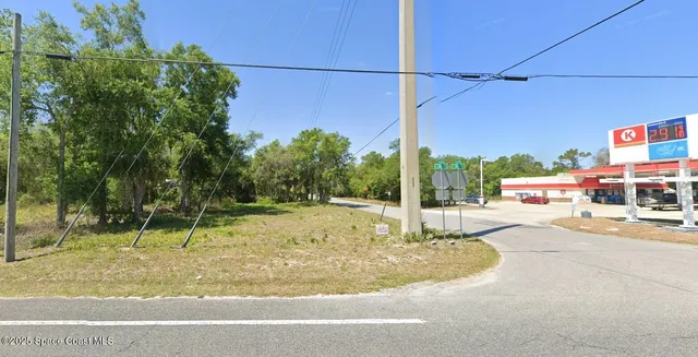 a swimming pool with outdoor seating and yard