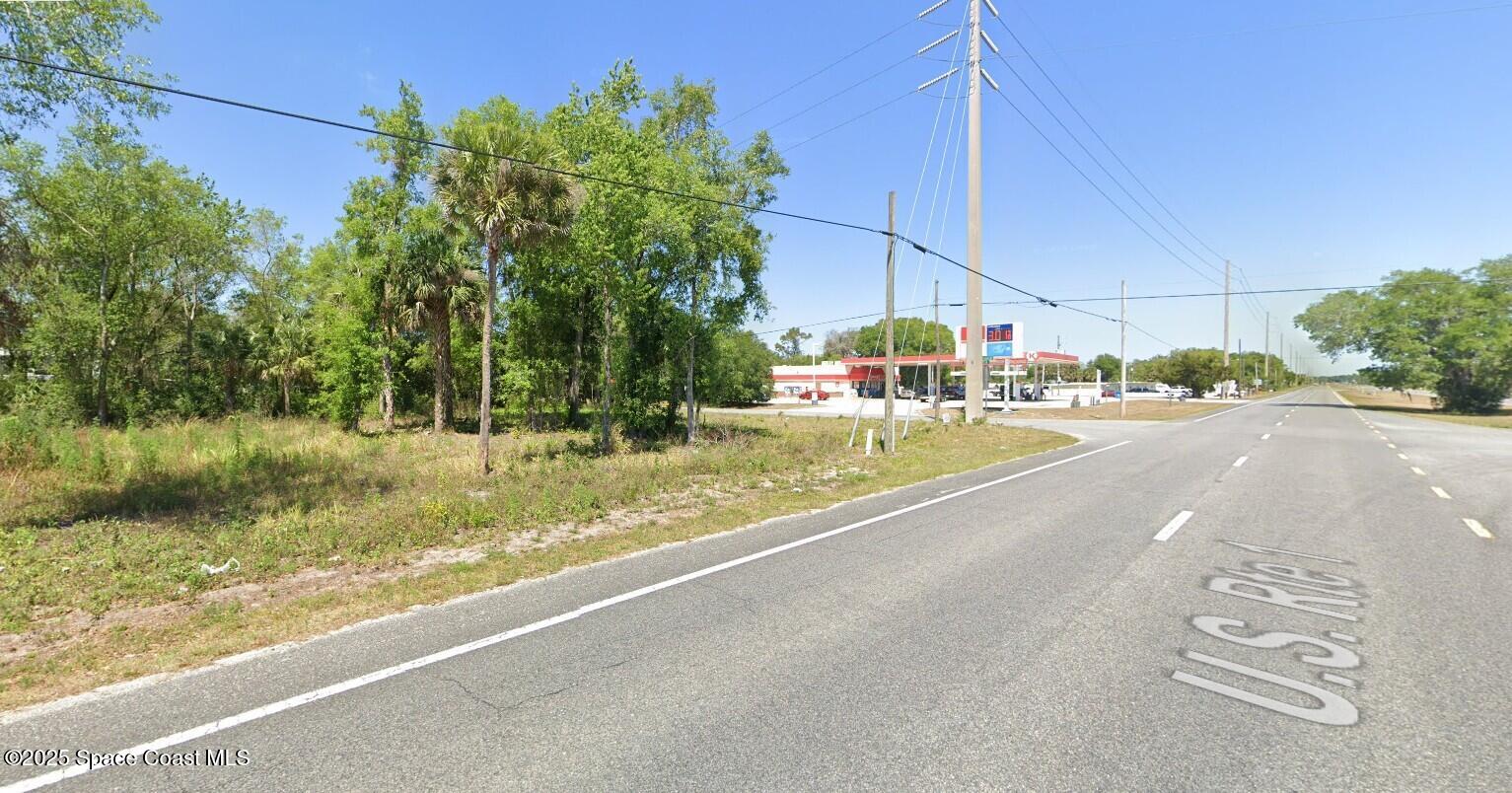 3817 Magoon Avenue Mims, FL 32754 - Photo 2 of 4 a view of a street with houses