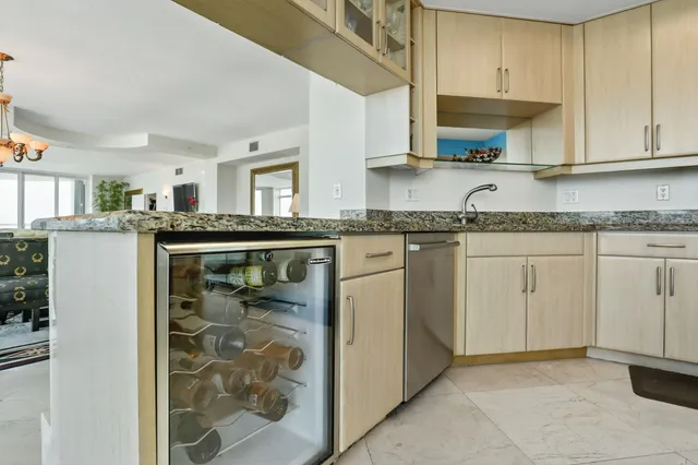 a kitchen with stainless steel appliances granite countertop a stove and a refrigerator