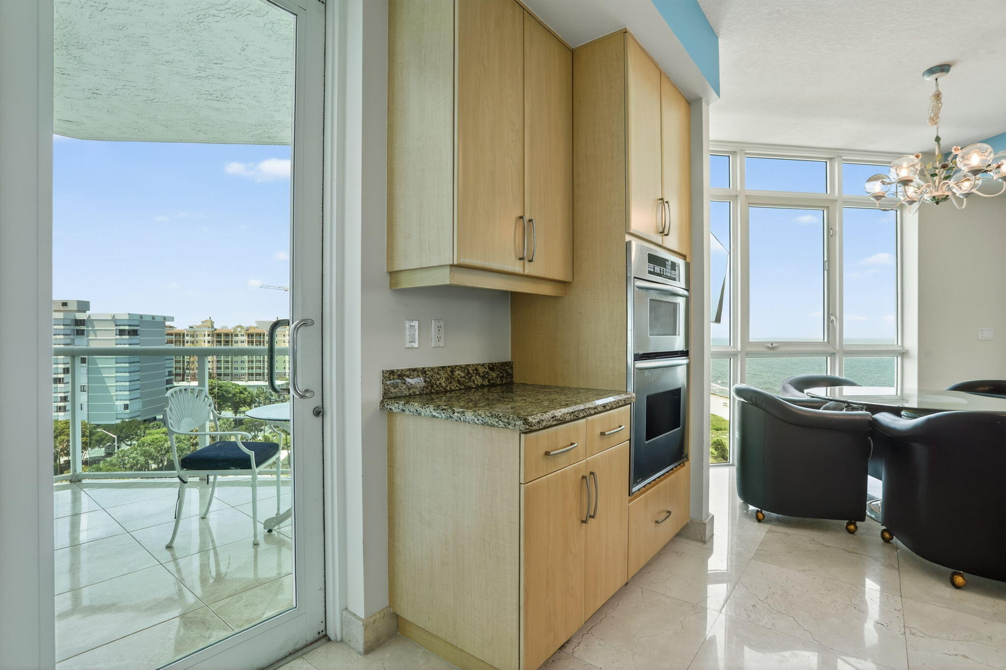 1430 South Ocean Boulevard, Unit 10A Lauderdale-by-the-Sea, FL 33062 - Photo 17 of 97 a kitchen with stainless steel appliances granite countertop a stove and a refrigerator
