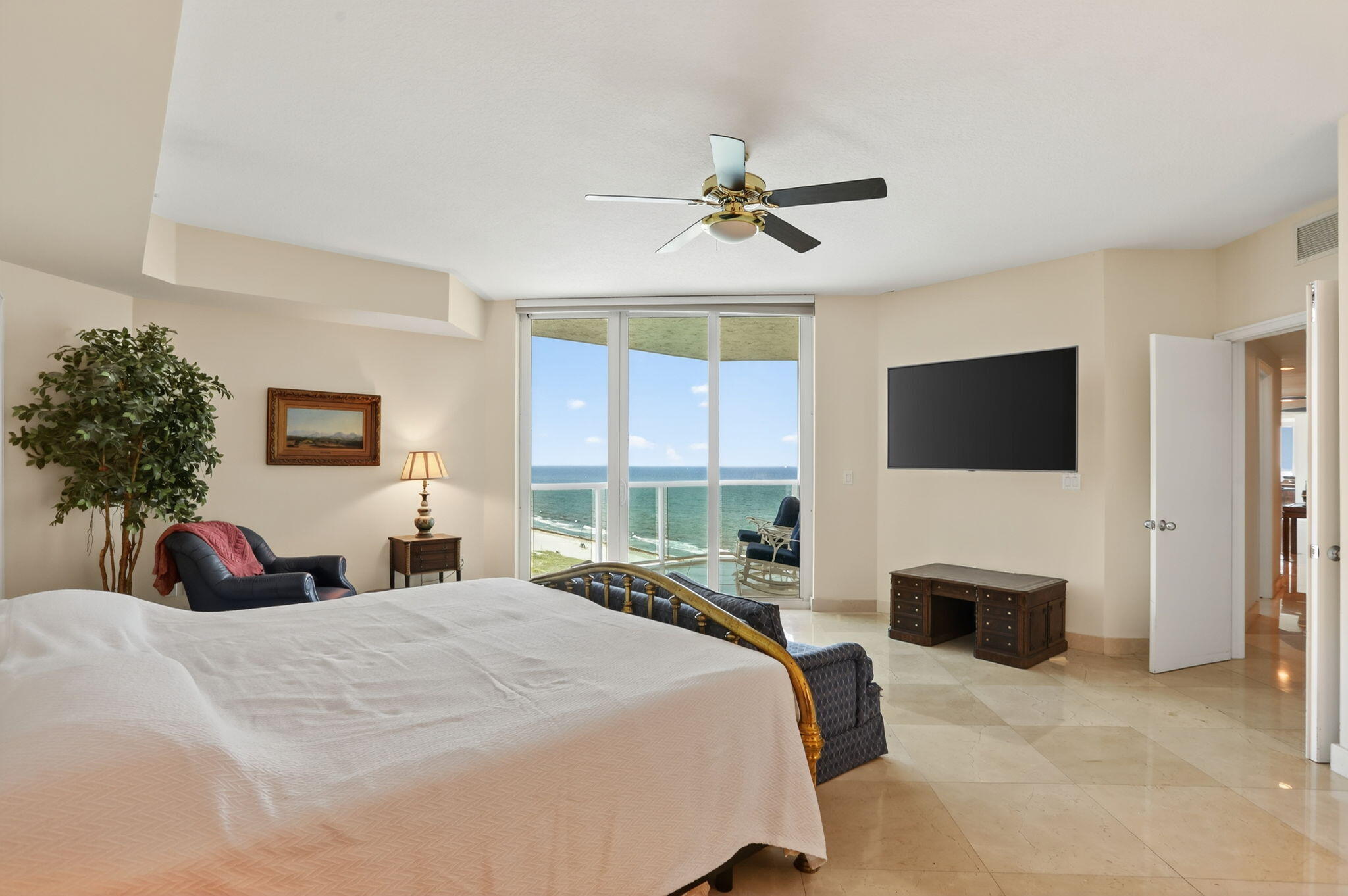 1430 South Ocean Boulevard, Unit 10A Lauderdale-by-the-Sea, FL 33062 - Photo 20 of 97 a bedroom with a bed and a flat screen tv