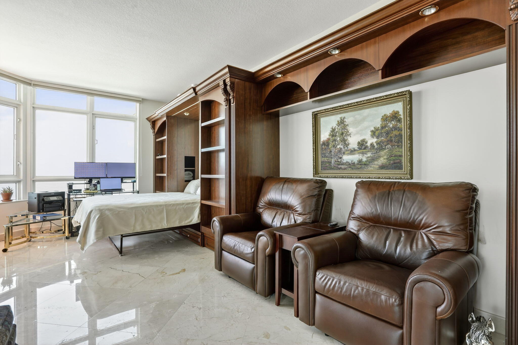 1430 South Ocean Boulevard, Unit 10A Lauderdale-by-the-Sea, FL 33062 - Photo 33 of 97 a bedroom with furniture and a painting on the wall