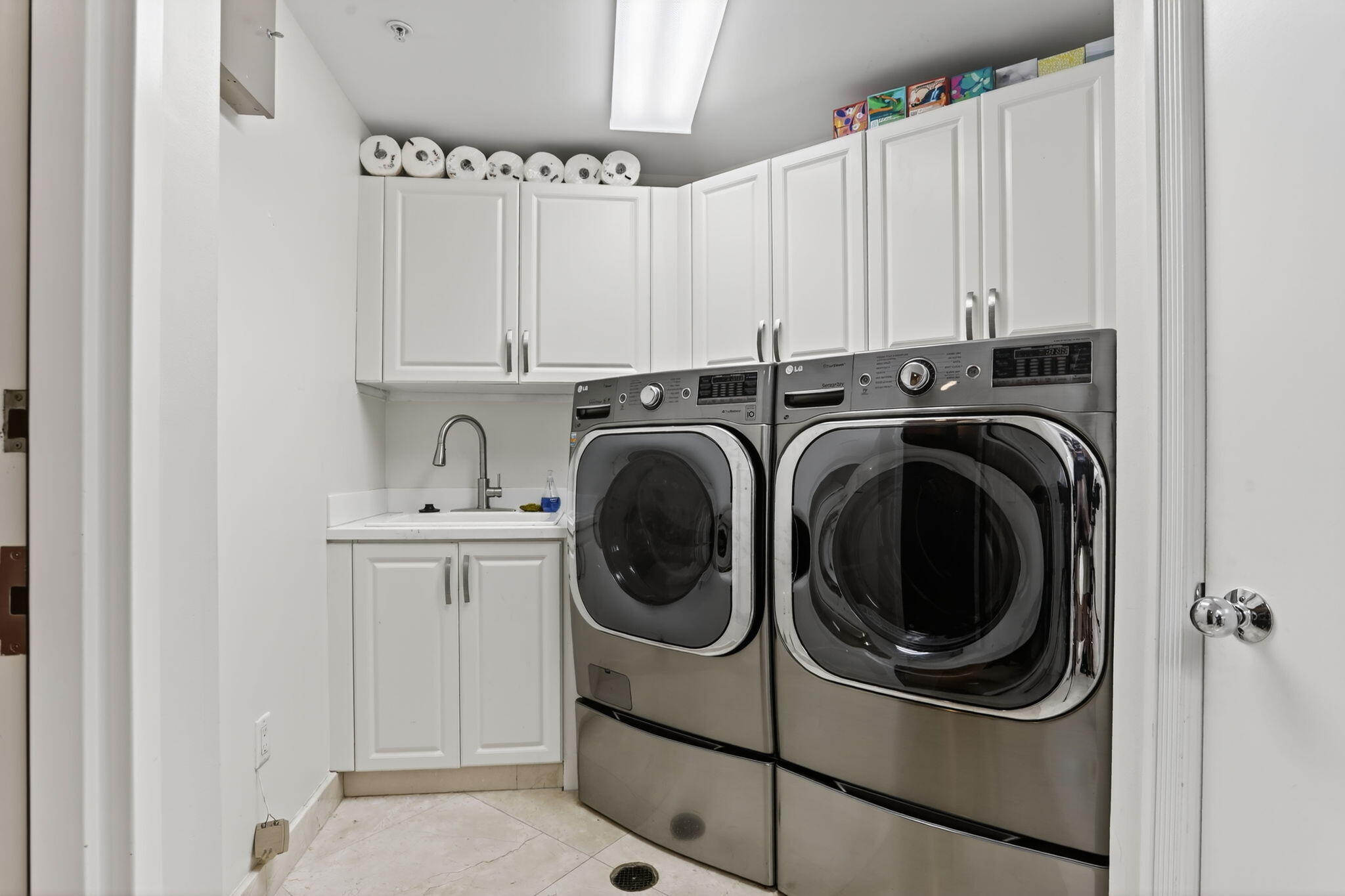 1430 South Ocean Boulevard, Unit 10A Lauderdale-by-the-Sea, FL 33062 - Photo 37 of 97 a utility room with sink dryer and washer