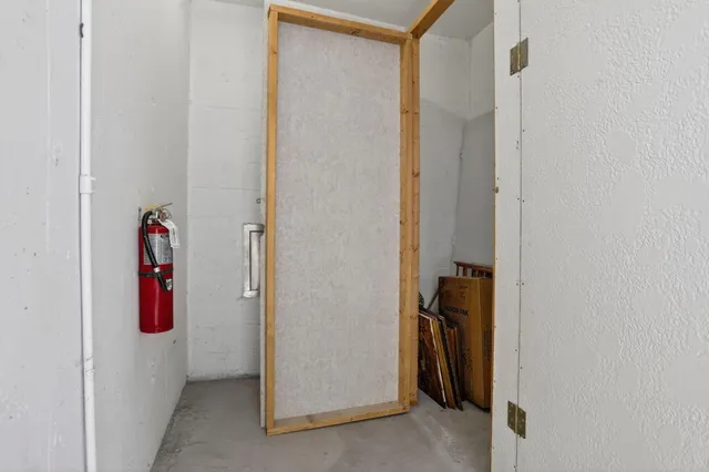 a view of a swimming pool with outdoor seating and plants