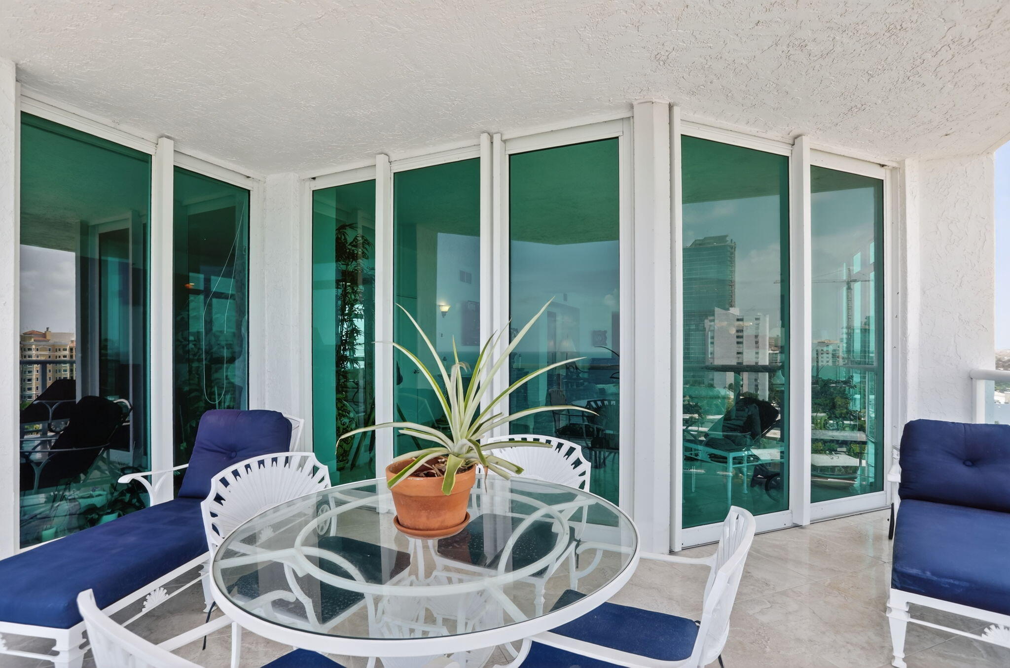 1430 South Ocean Boulevard, Unit 10A Lauderdale-by-the-Sea, FL 33062 - Photo 42 of 97 a room with furniture and a floor to ceiling window