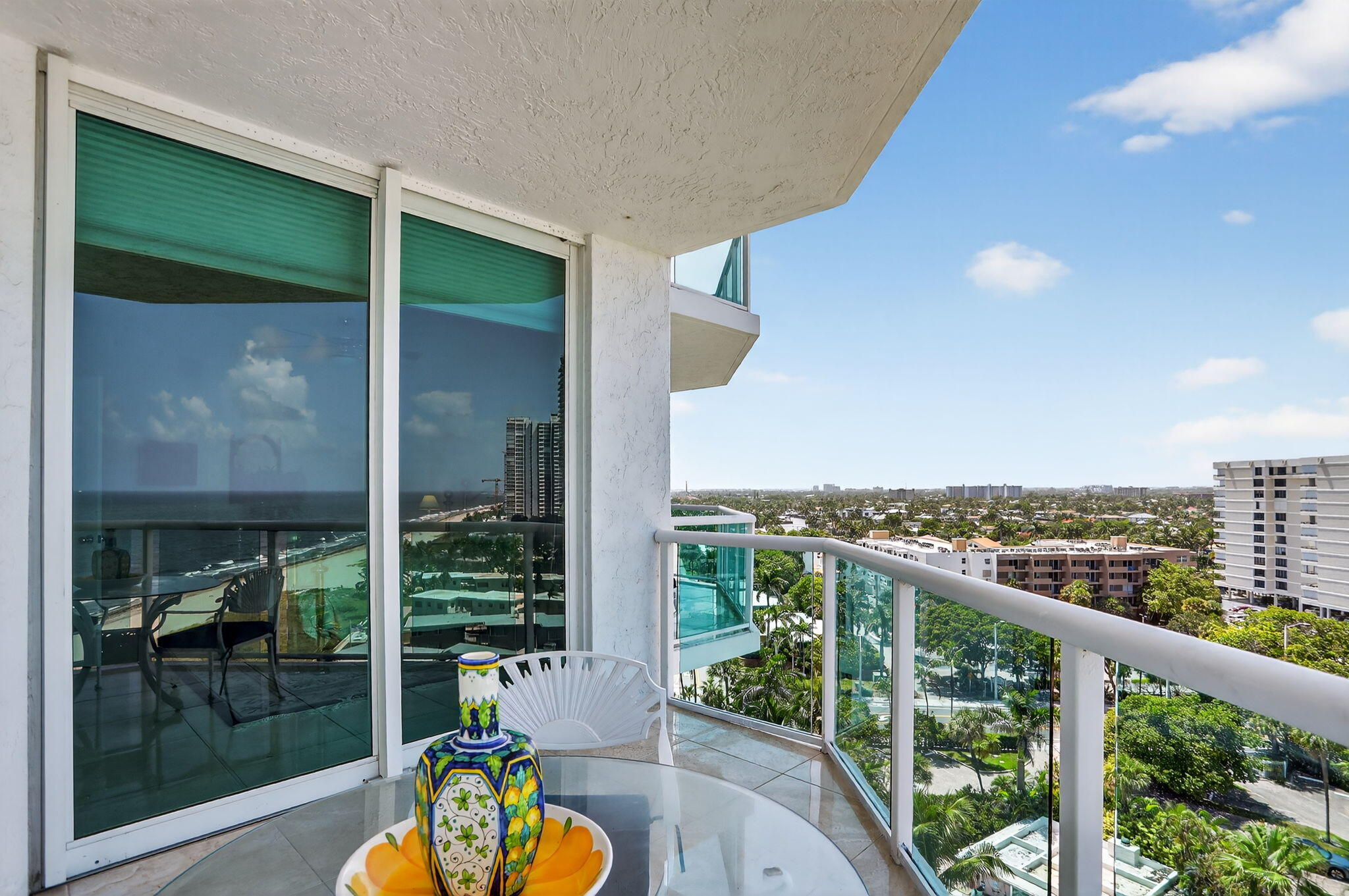 1430 South Ocean Boulevard, Unit 10A Lauderdale-by-the-Sea, FL 33062 - Photo 44 of 97 a view of a balcony with lake view and a potted plant