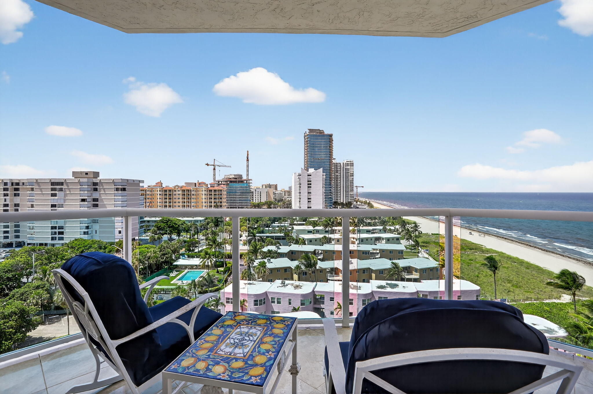 1430 South Ocean Boulevard, Unit 10A Lauderdale-by-the-Sea, FL 33062 - Photo 46 of 97 a view of a city from a chairs and table in patio
