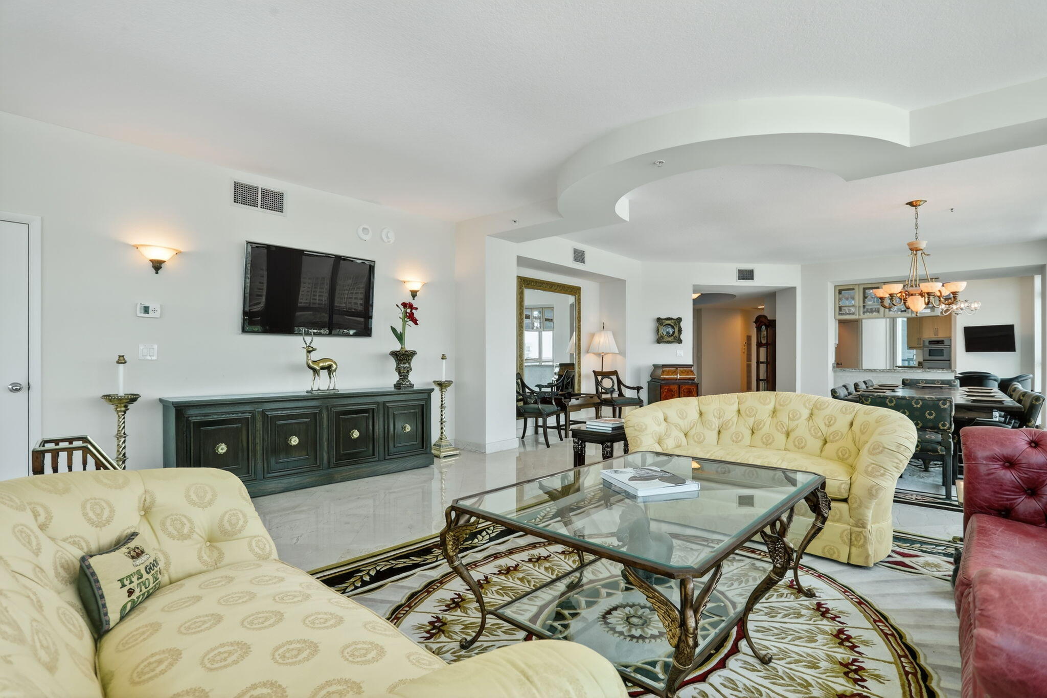 1430 South Ocean Boulevard, Unit 10A Lauderdale-by-the-Sea, FL 33062 - Photo 7 of 97 a living room with furniture and a flat screen tv