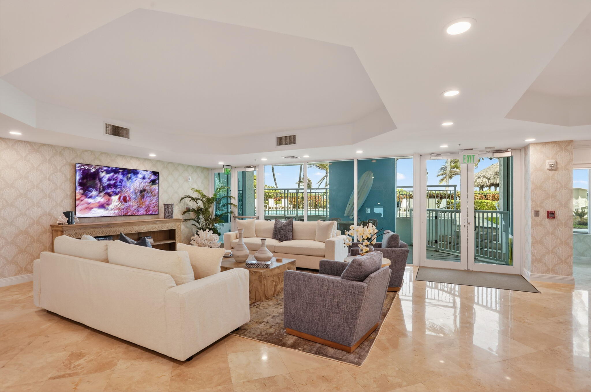 1430 South Ocean Boulevard, Unit 10A Lauderdale-by-the-Sea, FL 33062 - Photo 69 of 97 a living room with furniture a large window and a flat screen tv