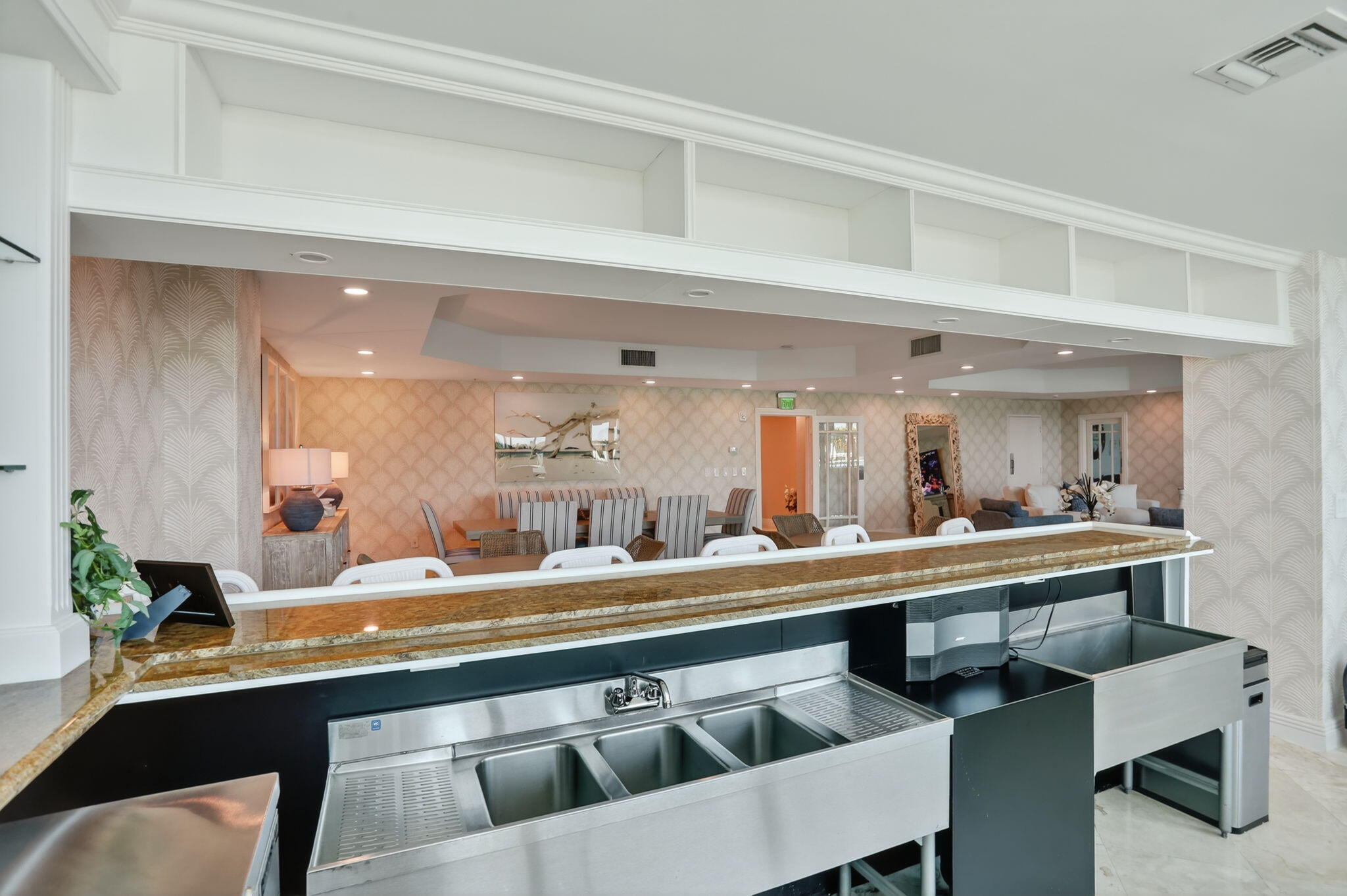 1430 South Ocean Boulevard, Unit 10A Lauderdale-by-the-Sea, FL 33062 - Photo 72 of 97 a dining hall with a dining table and chairs