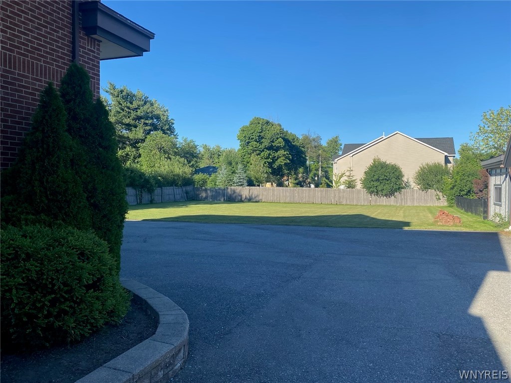 150 South Forest Road Amherst, NY 14221 - Photo 4 of 21 rear drive garages and yard