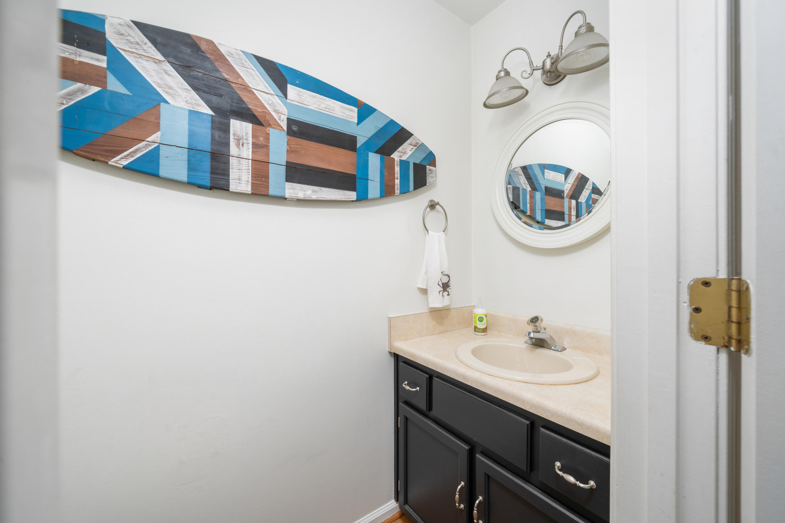 3341 Hidden Oak Road Southwest Roanoke, VA 24018 - Photo 11 of 26 a bathroom with a sink and a mirror