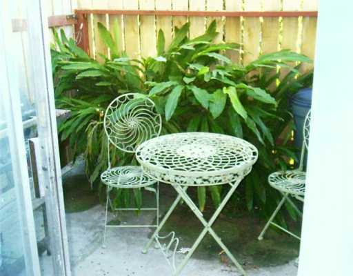 1011 Ennis Joslin Road, Unit 113 Corpus Christi, TX 78412 - Photo 4 of 5 a table with glass top table
