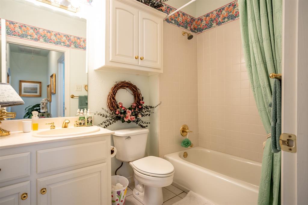 300 East Redbud Lane Lancaster, TX 75146 - Photo 26 of 31 a bathroom with a sink toilet and shower