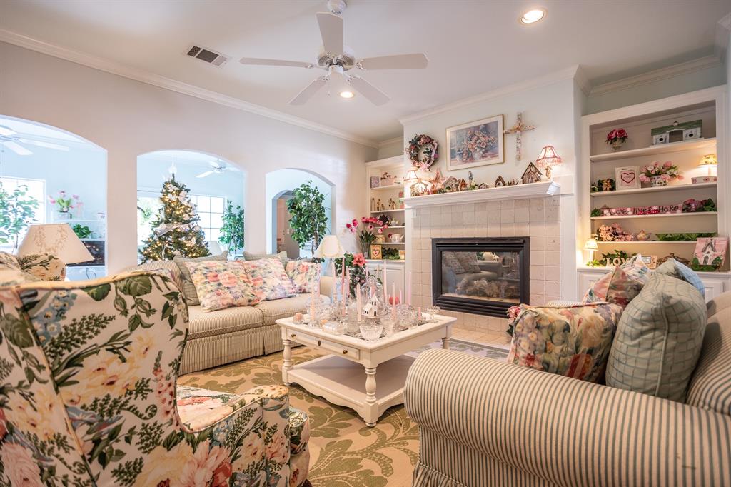300 East Redbud Lane Lancaster, TX 75146 - Photo 6 of 31 a living room with furniture and a fireplace