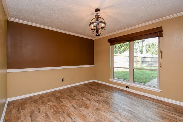 a view of room with window and ceiling fan