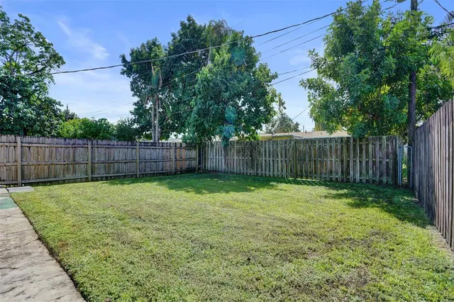 a view of a backyard with a trees