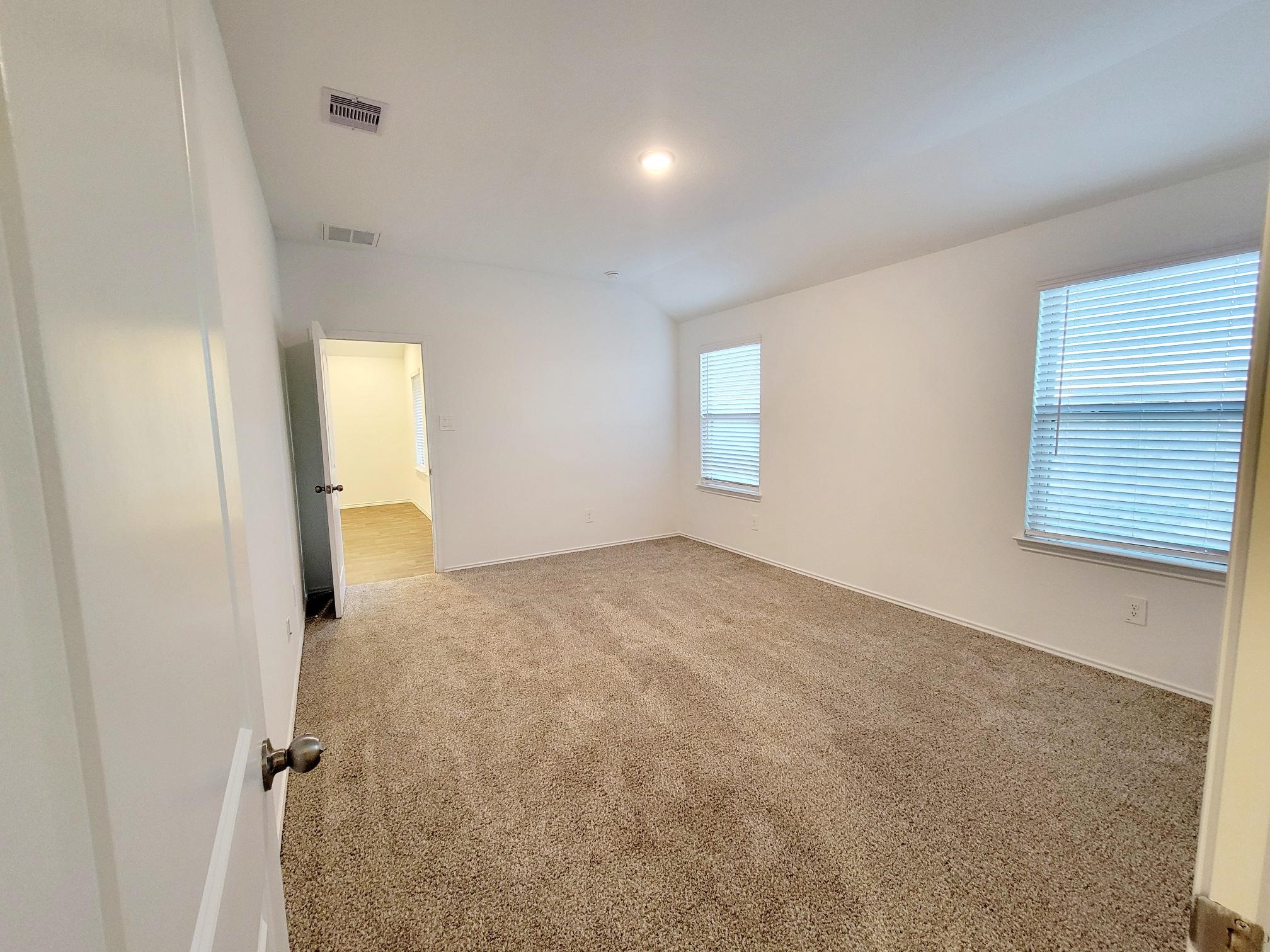 21522 Violet Ridge Road Katy, TX 77449 - Photo 13 of 40 an empty room with windows