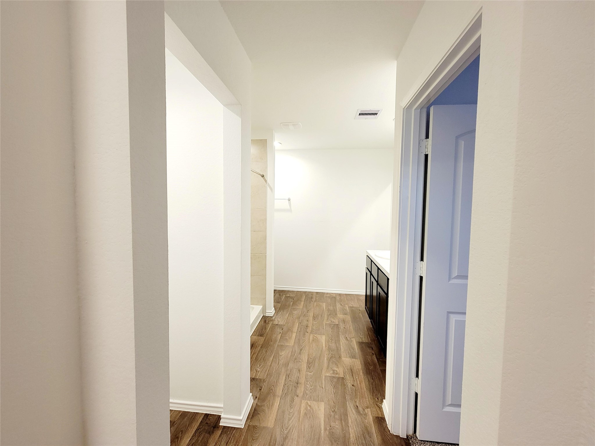 21522 Violet Ridge Road Katy, TX 77449 - Photo 17 of 40 a view of hallway with wooden floor