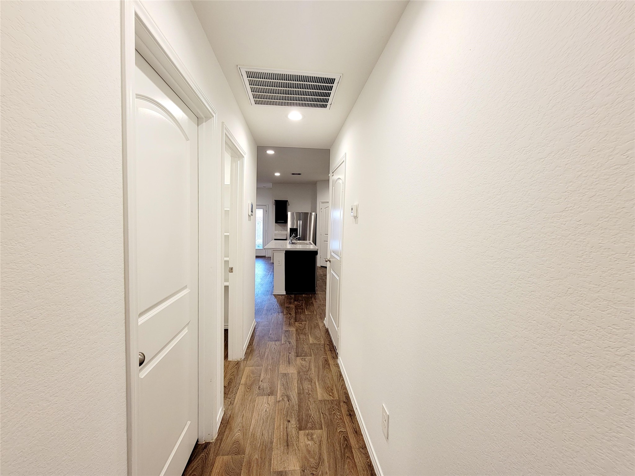 21522 Violet Ridge Road Katy, TX 77449 - Photo 28 of 40 a view of a hallway with wooden floor
