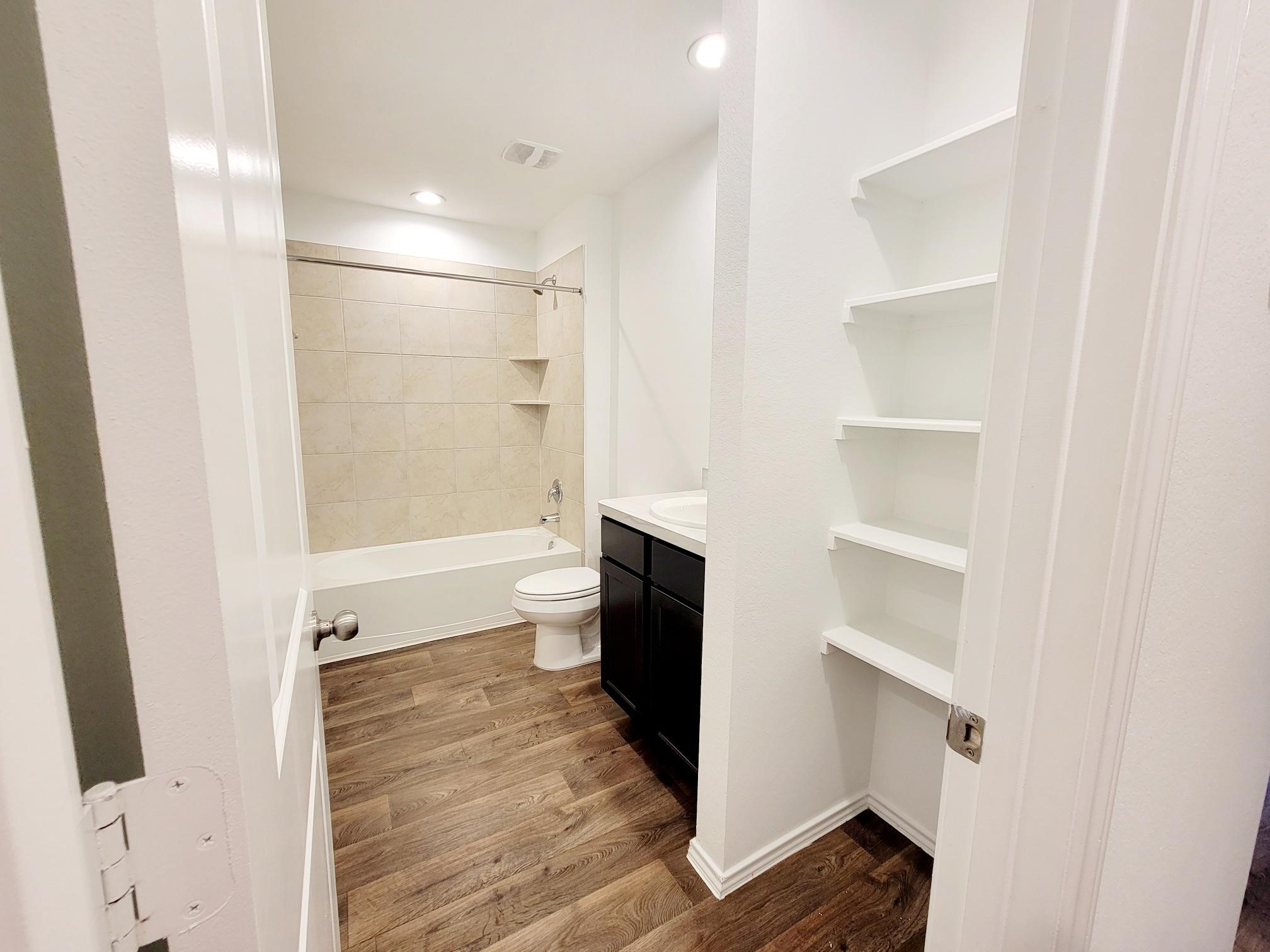 21522 Violet Ridge Road Katy, TX 77449 - Photo 30 of 40 a spacious bathroom with a shower and a toilet