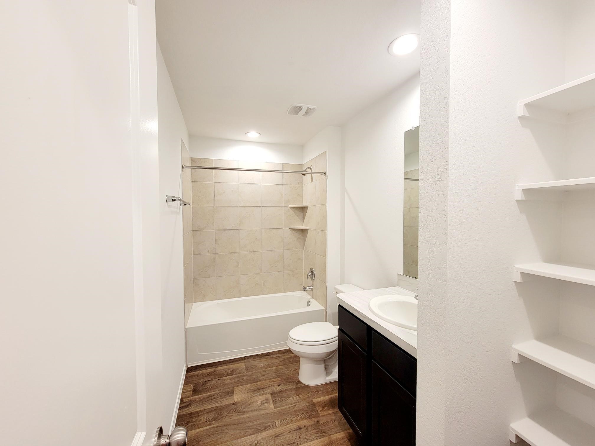 21522 Violet Ridge Road Katy, TX 77449 - Photo 31 of 40 a bathroom with a double vanity sink toilet and shower