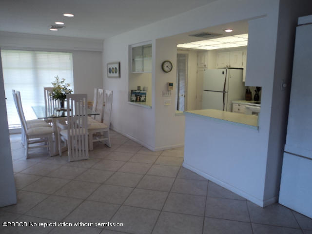 314 Cedar Key Circle Atlantis, FL 33462 - Photo 11 of 23 a view of a livingroom and a dining room with furniture