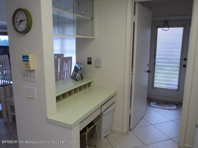 314 Cedar Key Circle Atlantis, FL 33462 - Photo 13 of 23 a view of storage and utility room with two washing machine